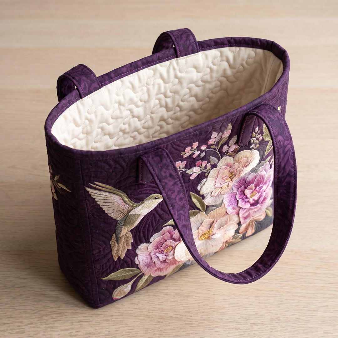 Bolso Artesanal Acolchado — Colibríes y Orquídeas: abierto, mostrando el forro acolchado en crema liso